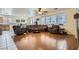 Open concept living room leading to dining area featuring hardwood floors at 6019 Orca Lilly St, North Las Vegas, NV 89031