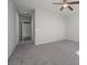 Carpeted bedroom with a ceiling fan and a closet at 2039 Port Royal Dr, Laughlin, NV 89029