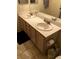 Bathroom featuring double sink vanity and tile floors at 3046 Tarpon Dr # 103, Las Vegas, NV 89120