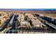 An expansive view featuring condos, pool, and tennis court, set against a backdrop of desert and distant mountains at 3550 Bay Sands Dr # 2076, Laughlin, NV 89029