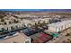 A scenic aerial view of a residential complex with a swimming pool and tennis courts amidst desert landscape at 3550 Bay Sands Dr # 2076, Laughlin, NV 89029