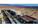 An aerial view of a condominium complex featuring well-maintained tennis courts, a pool, and covered parking at 3550 Bay Sands Dr # 2076, Laughlin, NV 89029