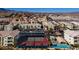 A beautiful aerial view of a residential community with a pool and tennis court on a sunny day at 3550 Bay Sands Dr # 2076, Laughlin, NV 89029