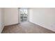 A bright bedroom with carpet floors and a sliding glass door to the balcony at 3550 Bay Sands Dr # 2076, Laughlin, NV 89029