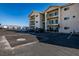 Attractive multi-story condo building with private balconies and parking set against a desert and mountain backdrop at 3550 Bay Sands Dr # 2076, Laughlin, NV 89029