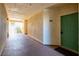 Well-lit hallway of condo building featuring unit number 2076 and staircase access to other floors at 3550 Bay Sands Dr # 2076, Laughlin, NV 89029
