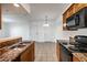 A spacious kitchen features granite countertops and views to an open space with two entry doors at 3550 Bay Sands Dr # 2076, Laughlin, NV 89029