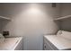 Bright laundry room with side by side washer and dryer at 3550 Bay Sands Dr # 2076, Laughlin, NV 89029