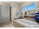 Elegant bathroom featuring a large soaking tub, double vanity, and walk-in shower at 5079 Mountain Top Cir, Las Vegas, NV 89148