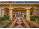 Covered patio with checkered flooring and lush landscaping at 5079 Mountain Top Cir, Las Vegas, NV 89148