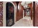 Elegant hallway with dark wood and ornate wallpaper at 5079 Mountain Top Cir, Las Vegas, NV 89148