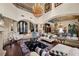 Open floor plan living room with high ceilings, hardwood floors, and chandelier at 5079 Mountain Top Cir, Las Vegas, NV 89148
