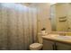 Clean bathroom with shower/tub combo, vanity, and linen storage at 5467 Morning Swim Ln, Las Vegas, NV 89113