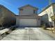 Two-story house with attached garage and desert landscaping at 6843 Toros St, North Las Vegas, NV 89086