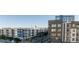 A modern apartment complex featuring multi-story buildings with blue and gray accents and private balconies at 700 W Carson Ave # 506, Las Vegas, NV 89106
