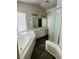 Bathroom with double vanity, soaking tub and walk-in shower at 1509 Blanco Dr, North Las Vegas, NV 89031