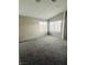 Bedroom with vaulted ceilings, carpet flooring and large windows at 1509 Blanco Dr, North Las Vegas, NV 89031