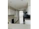 Bright kitchen with white cabinets, granite countertops, and stainless steel appliances at 1509 Blanco Dr, North Las Vegas, NV 89031