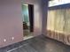 Main bedroom with neutral walls, wood-look floors and an ensuite bathroom at 1531 Singing Bird Ln, North Las Vegas, NV 89031