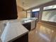 Kitchenette with white tile counters and hardwood floors at 1531 Singing Bird Ln, North Las Vegas, NV 89031