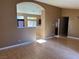 Spacious living room with hardwood floors, vaulted ceilings and an archway at 1531 Singing Bird Ln, North Las Vegas, NV 89031