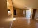 Open living area with hardwood floors, vaulted ceiling, and lots of natural light at 1531 Singing Bird Ln, North Las Vegas, NV 89031