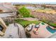 Beautiful backyard view features a pool, putting green, golf course, and serene lake backdrop at 2870 Quartz Canyon Dr, Henderson, NV 89052