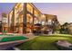 Outdoor oasis with pool, putting green, and patio area at 2870 Quartz Canyon Dr, Henderson, NV 89052