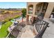 Backyard featuring a pool, putting green, outdoor seating, and stunning views from the upper level at 2870 Quartz Canyon Dr, Henderson, NV 89052