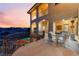 Spacious balcony with wrought iron railings and outdoor seating overlooking the pool and landscape at 2870 Quartz Canyon Dr, Henderson, NV 89052