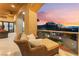 Covered balcony featuring comfortable lounge seating and stunning views of the landscape at 2870 Quartz Canyon Dr, Henderson, NV 89052