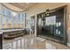 Luxury bathroom features a soaking tub, large shower, and panoramic windows providing great views at 2870 Quartz Canyon Dr, Henderson, NV 89052