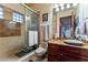 Granite counter bathroom with glass enclosed shower with dual shower heads at 2870 Quartz Canyon Dr, Henderson, NV 89052