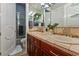 Bathroom with double sinks, custom cabinets, and tile shower at 2870 Quartz Canyon Dr, Henderson, NV 89052