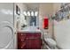 Whimsical bathroom featuring castle-themed wall art, red towel, and classic vanity at 2870 Quartz Canyon Dr, Henderson, NV 89052