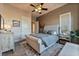Stylish bedroom featuring a tufted headboard and wood-look floors at 2870 Quartz Canyon Dr, Henderson, NV 89052