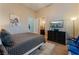 Bedroom featuring a bed, chest of drawers and an ensuite bathroom at 2870 Quartz Canyon Dr, Henderson, NV 89052