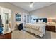 Cozy bedroom with neutral tones, ceiling fan, and walk-in shower at 2870 Quartz Canyon Dr, Henderson, NV 89052
