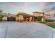 Elegant home featuring a porte cochere and a large driveway that leads to a beautiful home with a two-car garage at 2870 Quartz Canyon Dr, Henderson, NV 89052