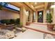 Inviting entryway with brick facade and lush landscaping at 2870 Quartz Canyon Dr, Henderson, NV 89052