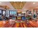 Spacious workout room with coffered ceilings, hardwood floors, exercise equipment, and an office area with a view at 2870 Quartz Canyon Dr, Henderson, NV 89052