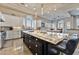 Spacious kitchen with a large island, granite countertops, stainless steel appliances, and pendant lighting at 2870 Quartz Canyon Dr, Henderson, NV 89052