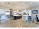 Open kitchen with a large island, modern appliances, white cabinetry, and marble flooring at 2870 Quartz Canyon Dr, Henderson, NV 89052