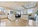 Bright and airy kitchen with white cabinetry, a large island, and a cozy dining area at 2870 Quartz Canyon Dr, Henderson, NV 89052