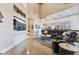 Expansive living room featuring a sleek entertainment unit, large windows and tile floors at 2870 Quartz Canyon Dr, Henderson, NV 89052
