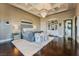 Luxurious main bedroom featuring hardwood floors, chandelier, and a sitting area at 2870 Quartz Canyon Dr, Henderson, NV 89052