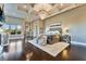 Spacious main bedroom featuring wood floors, a tray ceiling, a chandelier and view of neighborhood at 2870 Quartz Canyon Dr, Henderson, NV 89052