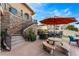 Beautiful outdoor patio featuring a bar, seating area, and stone accents, perfect for relaxing and enjoying the view at 2870 Quartz Canyon Dr, Henderson, NV 89052