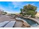 Backyard pool with ample patio space, lounge chairs, and a great view at 2870 Quartz Canyon Dr, Henderson, NV 89052