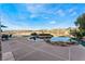 Backyard pool features a tanning ledge, rock waterfall, and patio space, perfect for entertaining at 2870 Quartz Canyon Dr, Henderson, NV 89052
